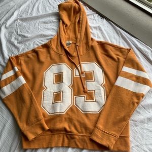 Cropped orange “83” hoodie